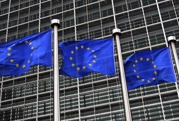 European Union flags fly in front of the European Commission headquarters in Brussels