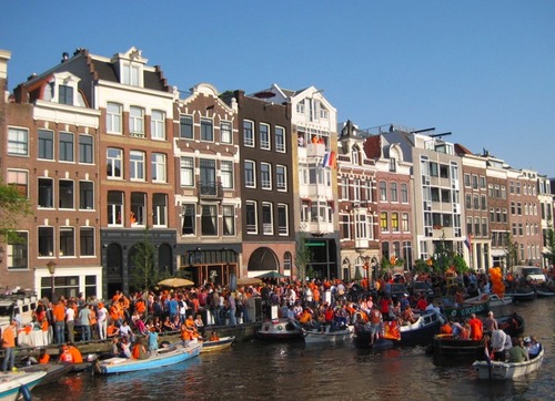 Kings day canal amsterdam sunshine