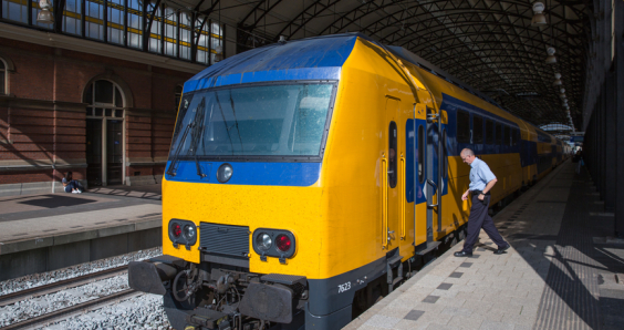 Conductor getting in a train ready to start in The Hague, the Netherlands