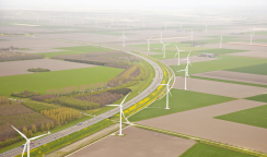 Dutch farm landscape with windmills and road from above, The Netherlands