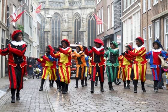 Dancers dressed as Zwarte Piet