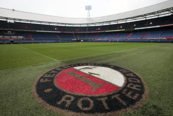 Feyenoord badge on the pitch in De Kuip stadium.