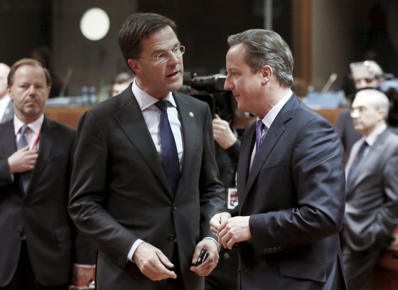 Netherlands' PM Rutte and British counterpart Cameron attend an EU leaders summit in Brussels
