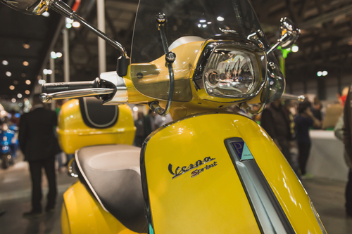 Vespa scooter on display at EICMA 2014 in Milan, Italy
