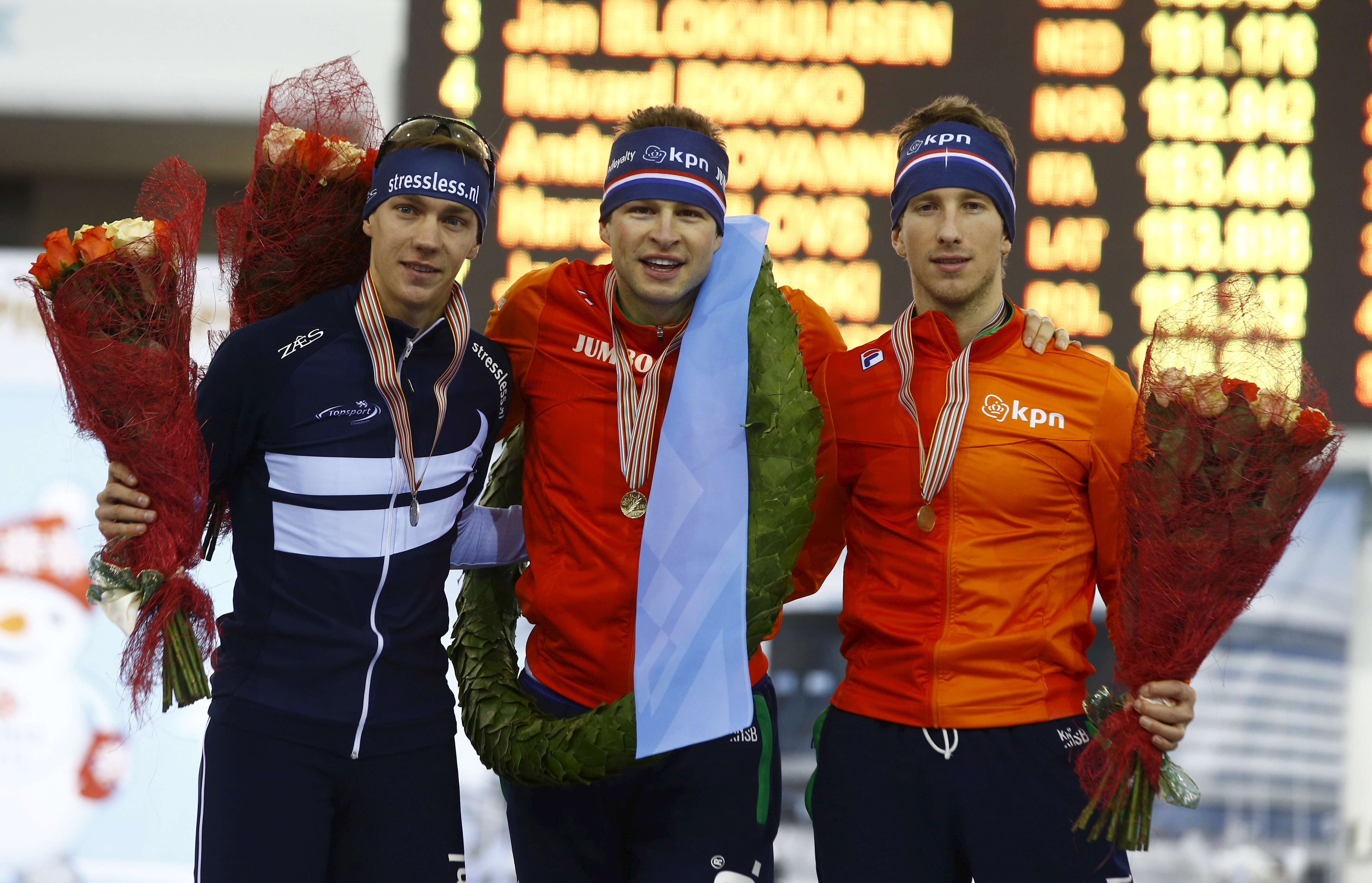 The Netherlands' Kramer, who won first place, Belgium's Swings, in second place and the Netherlands' Blockhuijsen, in third place in the final classification men, pose for a photo after the award ceremony during ISU European Speed Skating Championshi