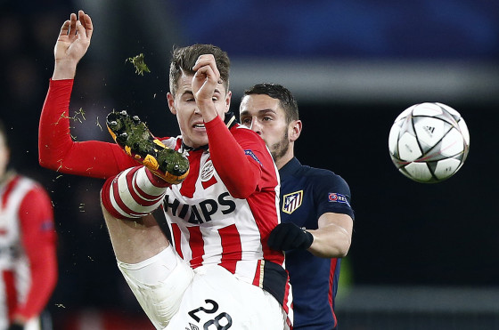 PSV's Marco van Ginkel, left, and Atletico's Tiago Mendez challenge for the ball. Photo AP Photo/Peter Dejong