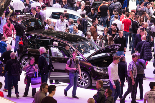 Checking out new cars at a motor show. Photo: Depositphotos.com