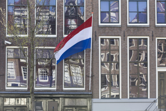 The Dutch flag hangs outside the Anne Frank house on Liberation Day. Photo: Niels Wenstedt / Hollandse Hoogte