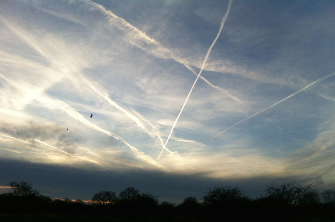 plane trails sky airport