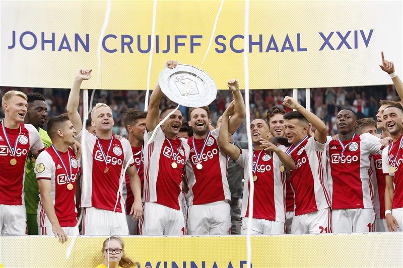 Ajax players raise the Johan Cruyff Shield after beating PSV 2-0.