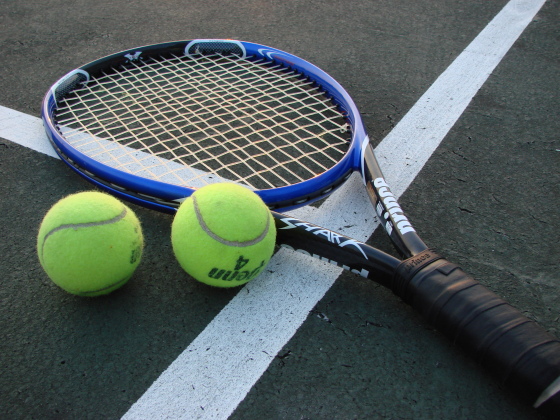 Tennis racket and balls.