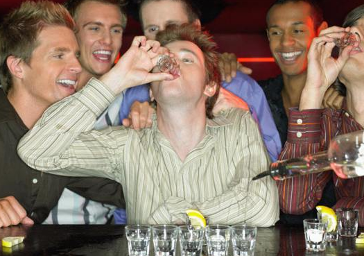 young men drinking shots