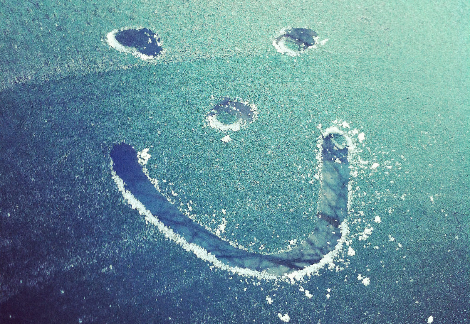 Smiley face on frozen windscreen