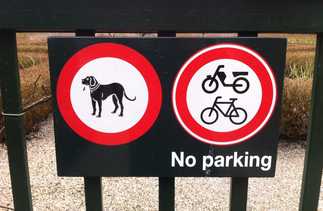 no dogs no bikes no mopeds no parking sign