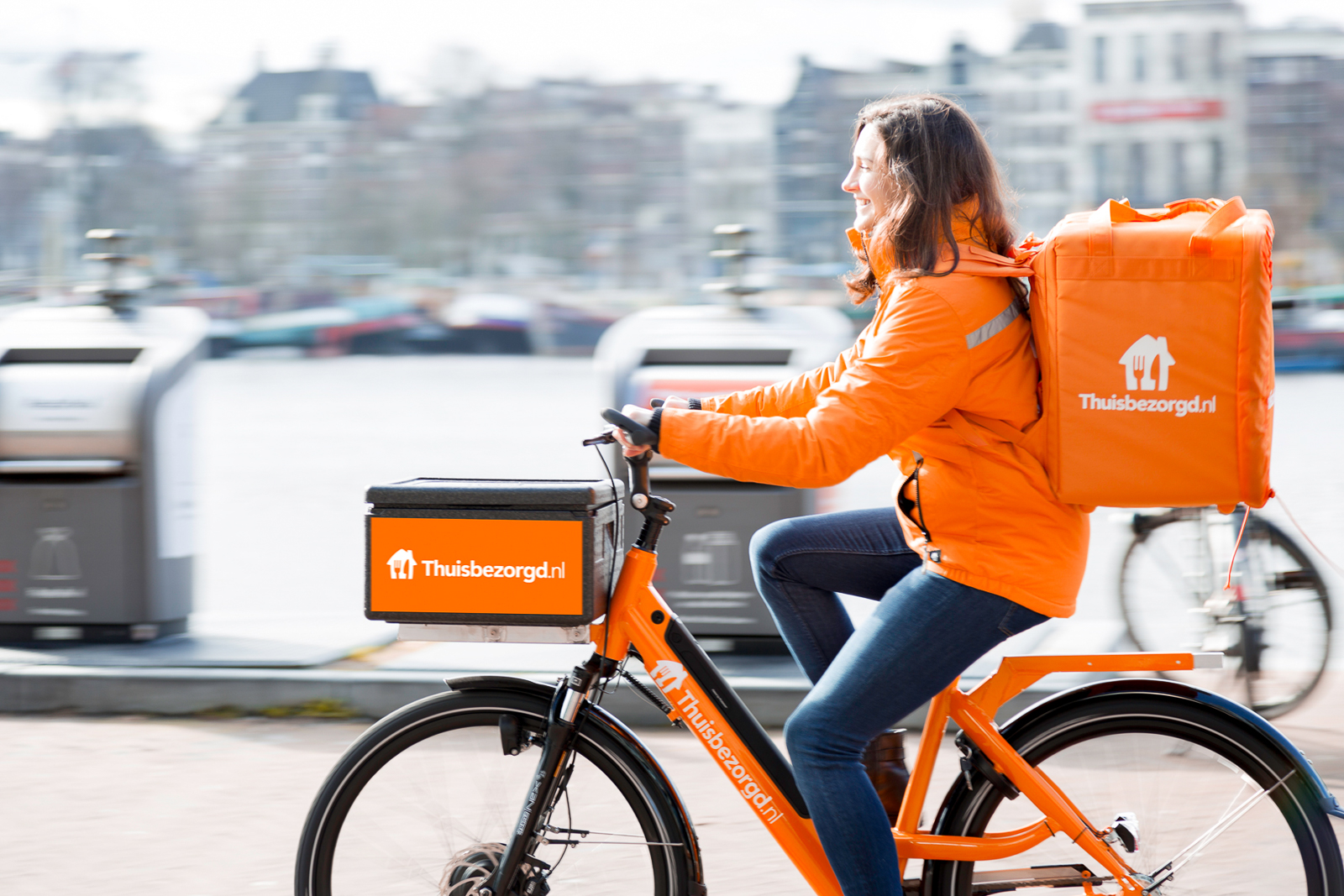 buys three German delivery services for €930m
