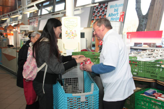 Shoppers using the food bank at an Albert Heijn store in Amsterdam