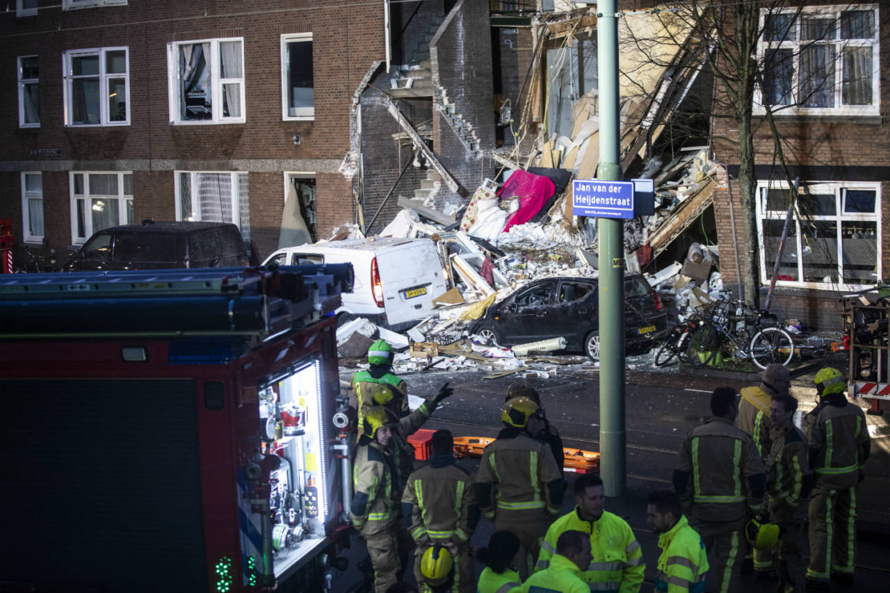 Rescue workers at the scene of a gas explosion in Jan van der Heijedenstraat, The Hague, where a man was trapped and nine people have been injured in a gas explosion.