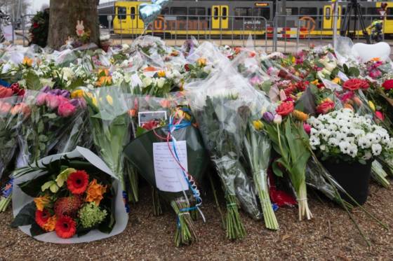 Bunches of flowers laid at the scene of the shooting.