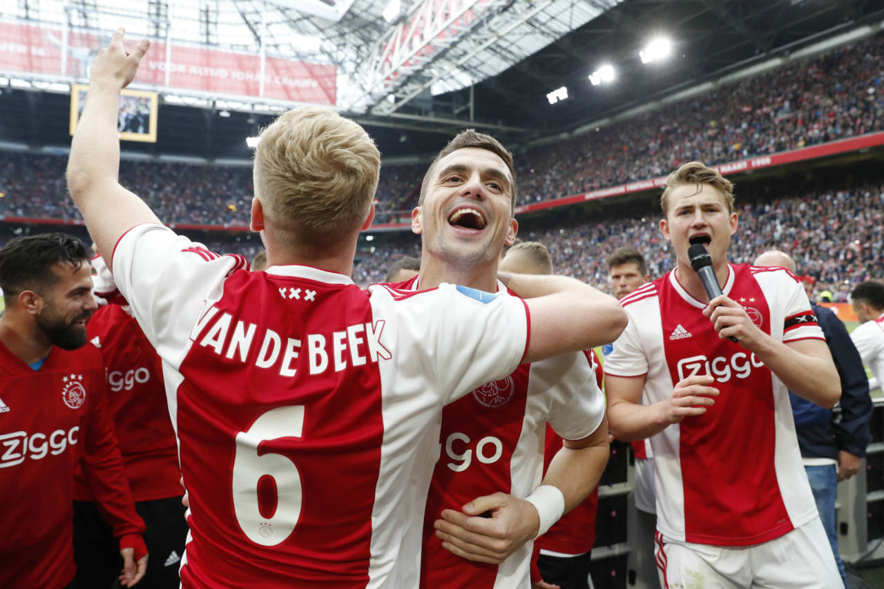 Ajax players Donny van de Beek, Dusan Tadic and Matthijs de Ligt celebrating after their 4-1 win over FC Utrecht.