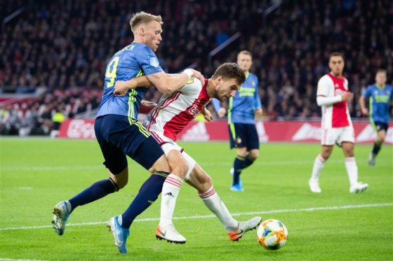 Nicolai Jorgensen of Feyenoord and Joel Veltman of Ajax contesting the ball