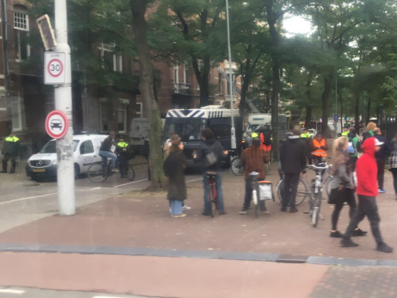 Police vans parked in the road outside the Rijksmuseum during the protest by Extinction Rebellion.