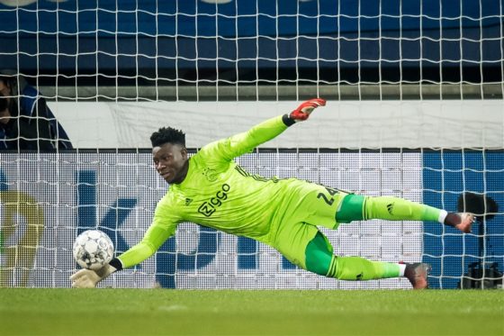 Andre Onana diving low to make a save against Heerenveen