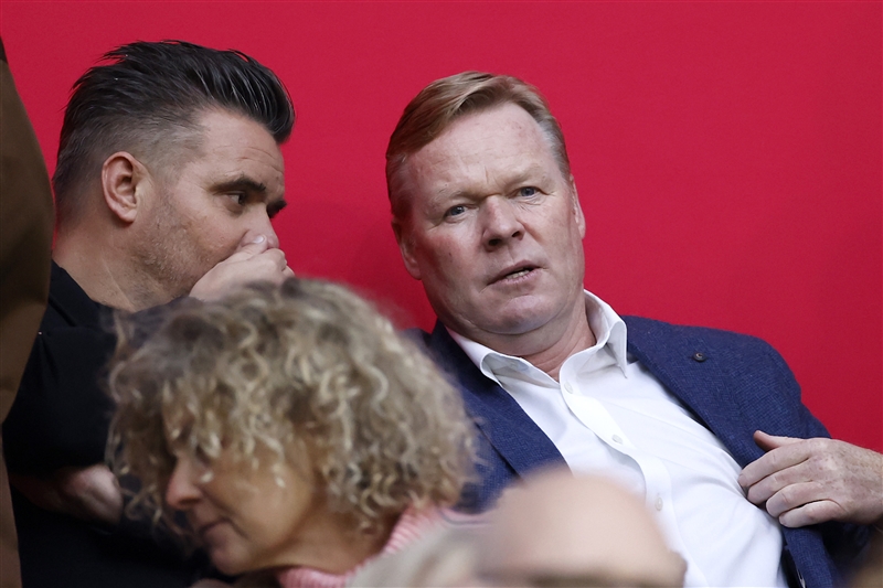 Ronald Koeman watching a football match.