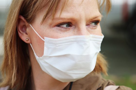 a woman wearing a non-surgical face mask