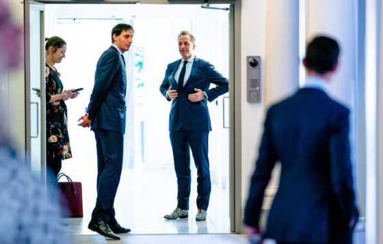 Wopke Hoekstra and Hugo de Jonge standing together in a doorway