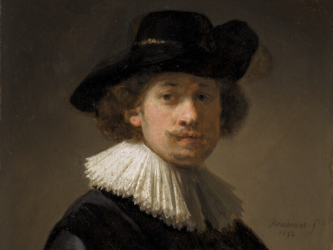 Detail of Rembrandt's self-portrait showing his face, hat and ruff.