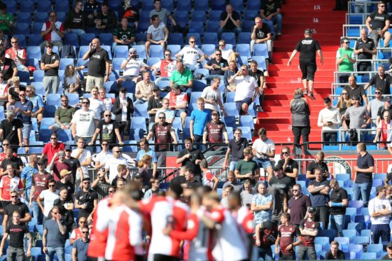 Feyenoord players during Saturday's game in front of a stand full of supporters.