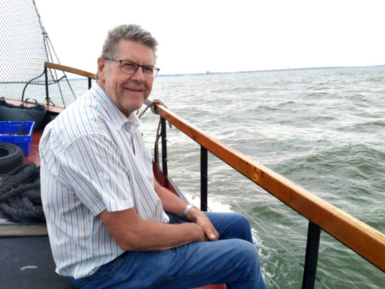 Johan Graas, founder of the volunteer Aircraft Recovery Group, on a boat during a visit to the recovery site.