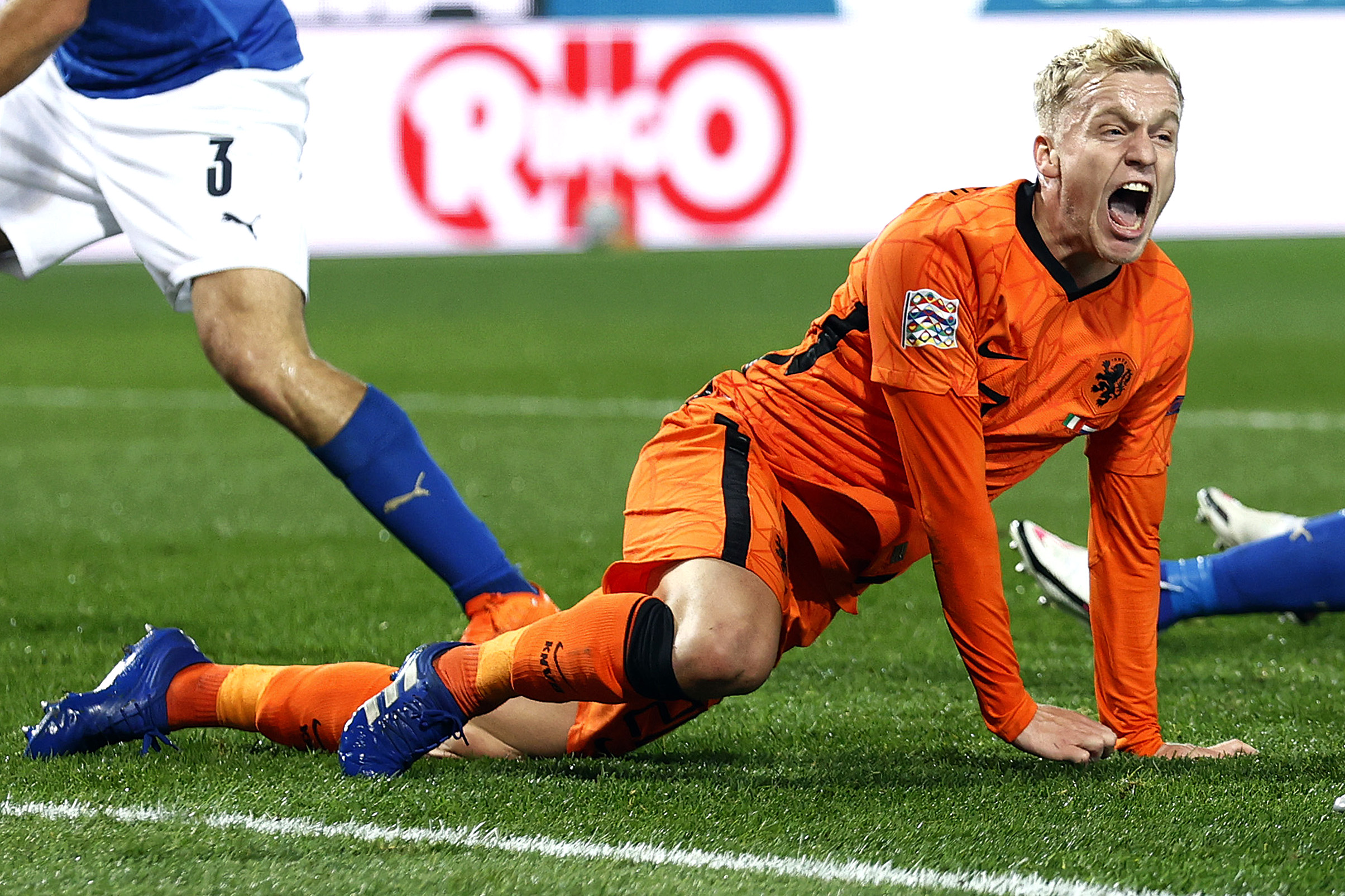 Midfielder Donny van de Beek roaring with delight as he crouches after scoring the equaliser.