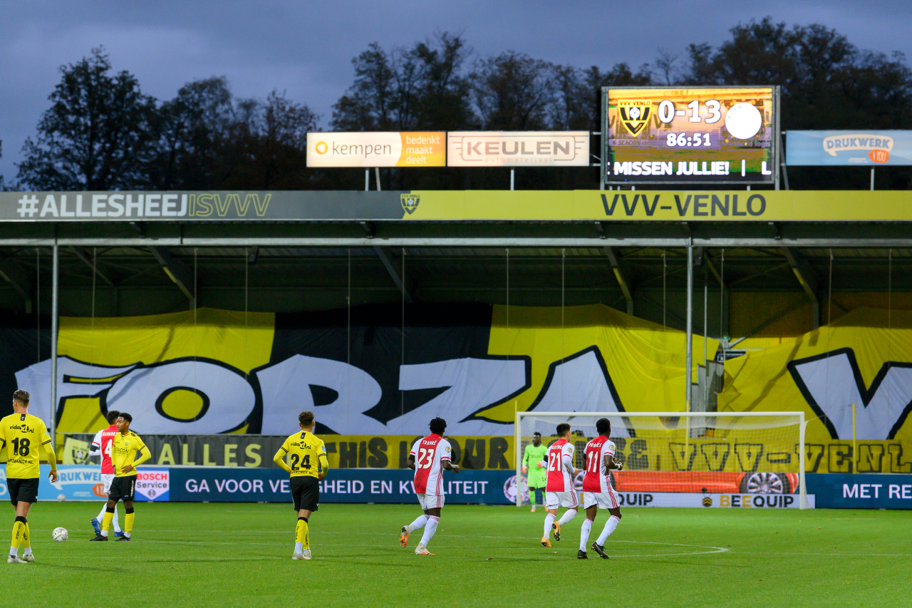 The scoreboard showing the 13-0 scoreline in the 87th minute above the players on the field.